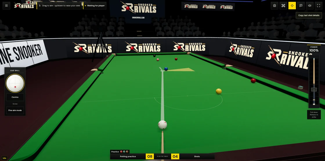 Aiming from behind the white ball towards the blue in the snooker stadium, with shot guides, spin controls and the power slider visible